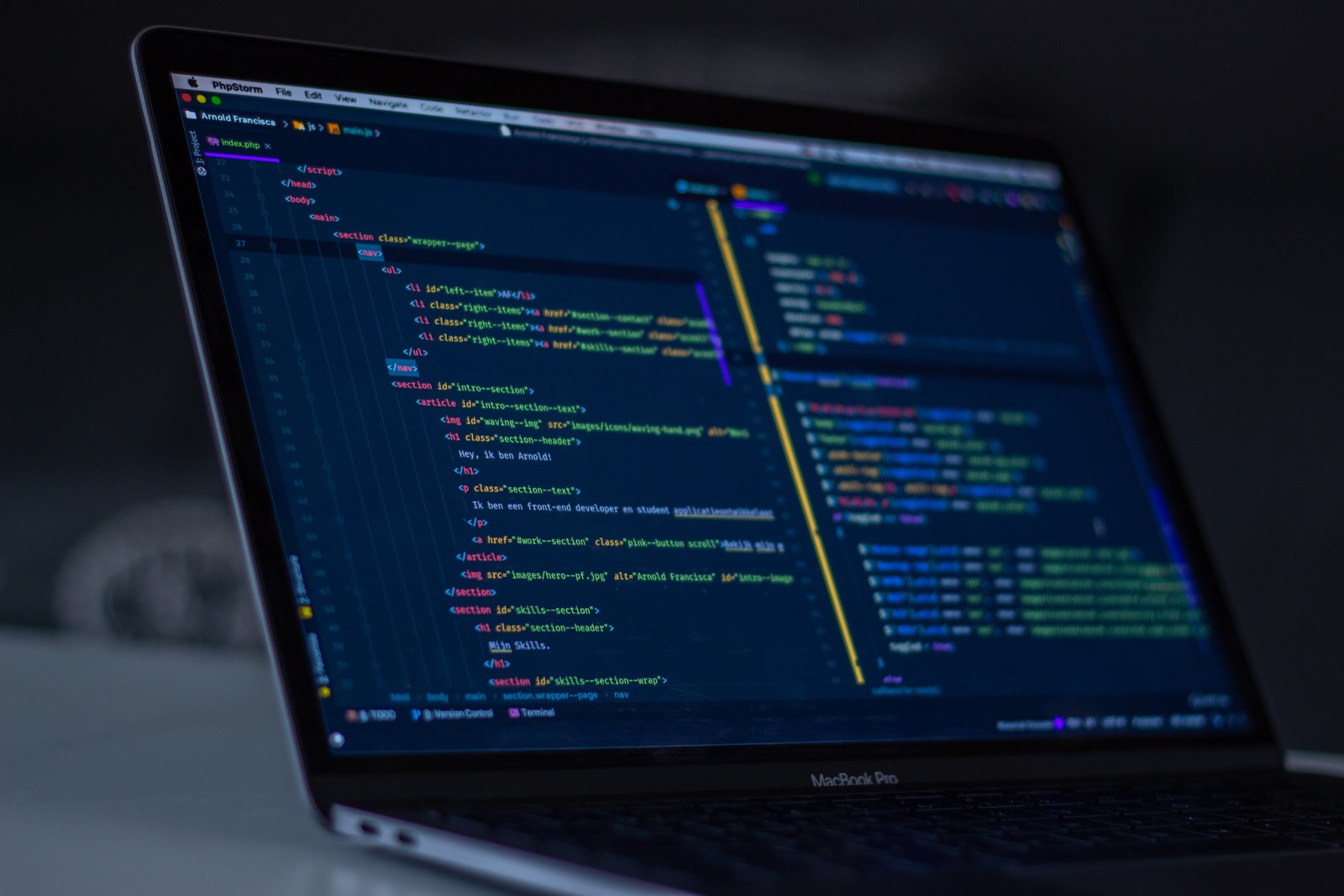MacBook Pro with programming code display